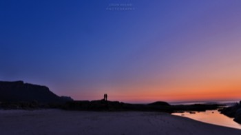  Couple facing the Sunset 